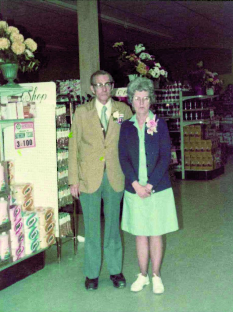 Old photo of couple in grocery story