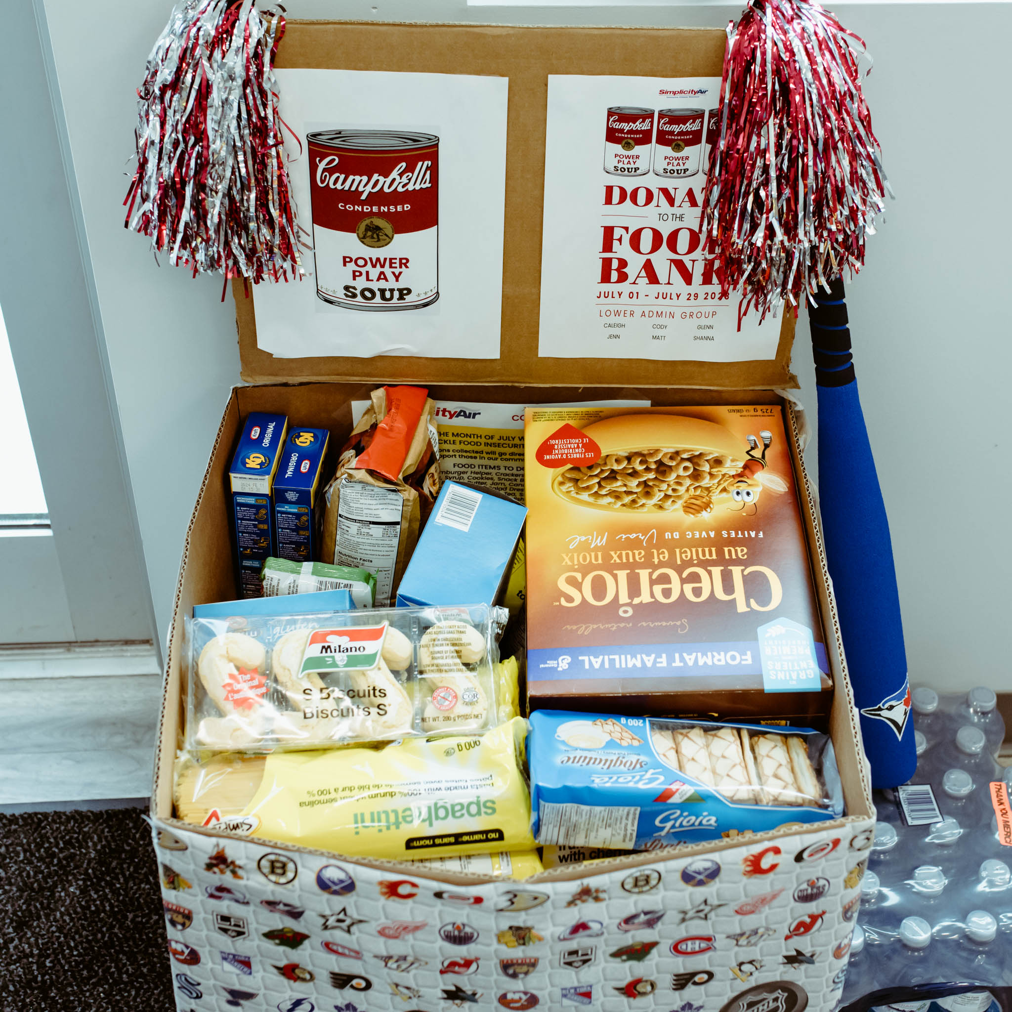 Featured image for Simplicity Air team shows support for food bank